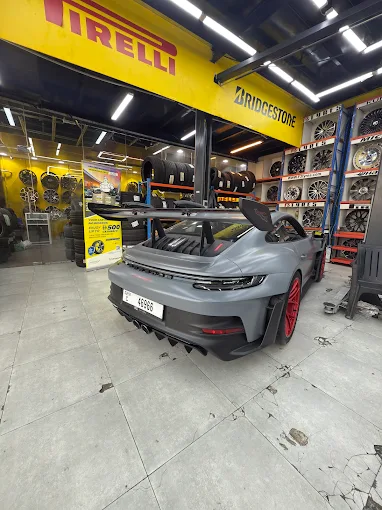 Khalid Amin Tyres showroom with premium car and rims